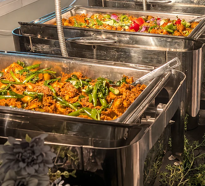 Catering buffet by PBF Kitchen: chafing dishes of Kerala curries under heat lamps at an event in Regina