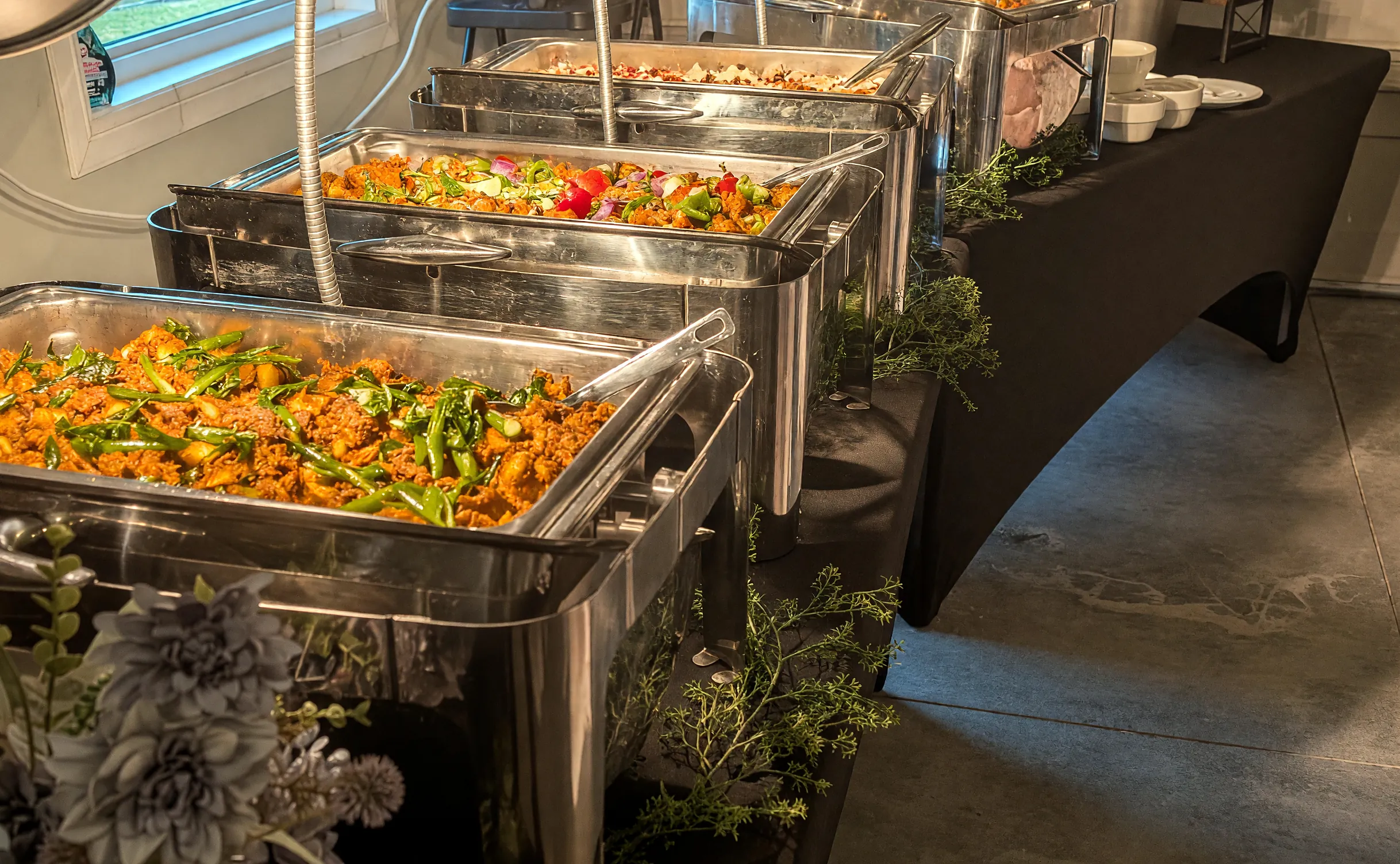 Catering buffet by PBF Kitchen: chafing dishes of Kerala curries under heat lamps at an event in Regina